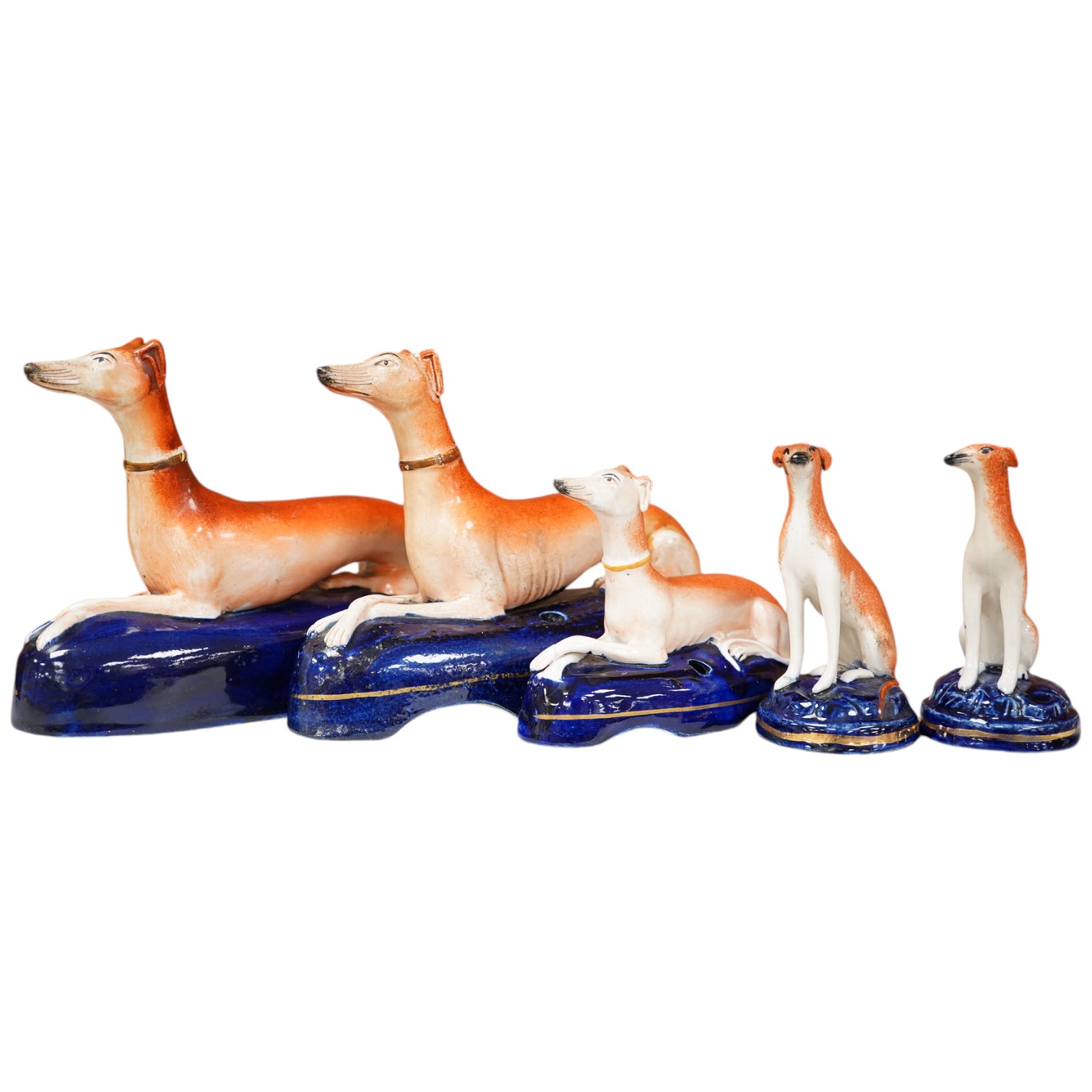 Three graduated Staffordshire pottery greyhounds and two others, longest 19cm (5). Condition - restored